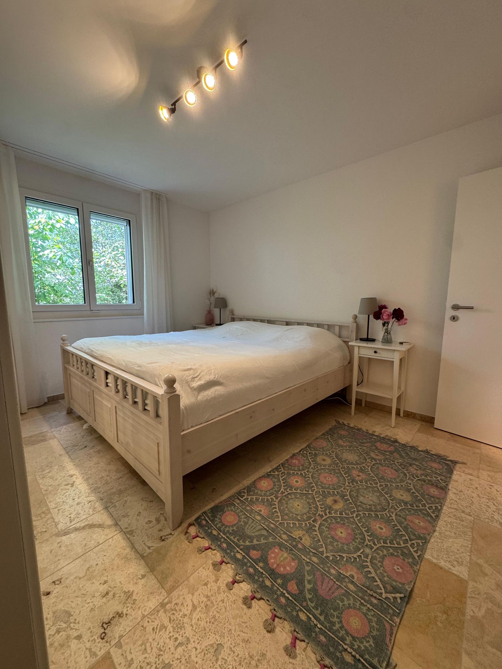 Second bedroom on the lower floor with a solid-wood bed