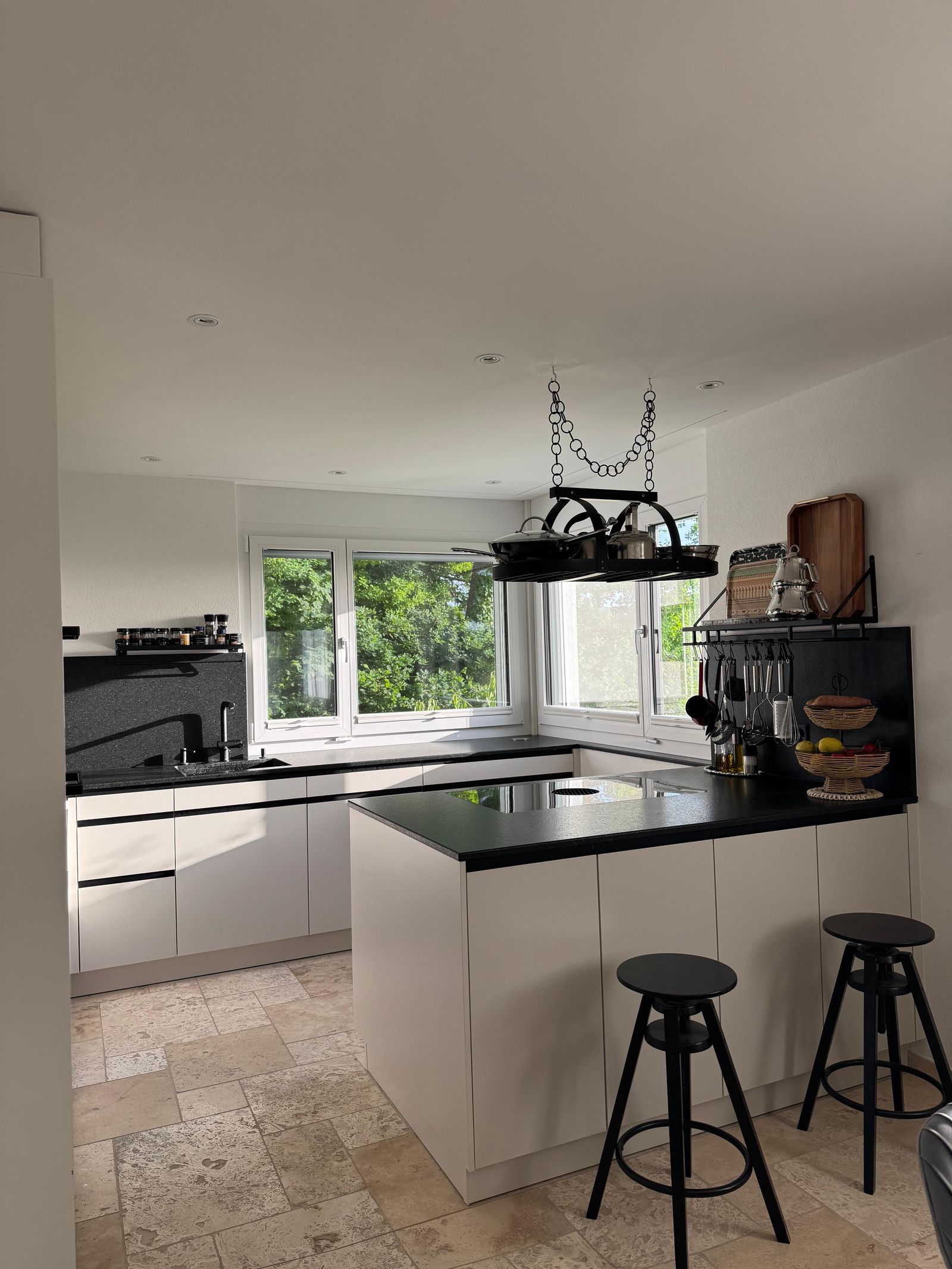 Designer kitchen with island, black worktop and Bora induction cooktop