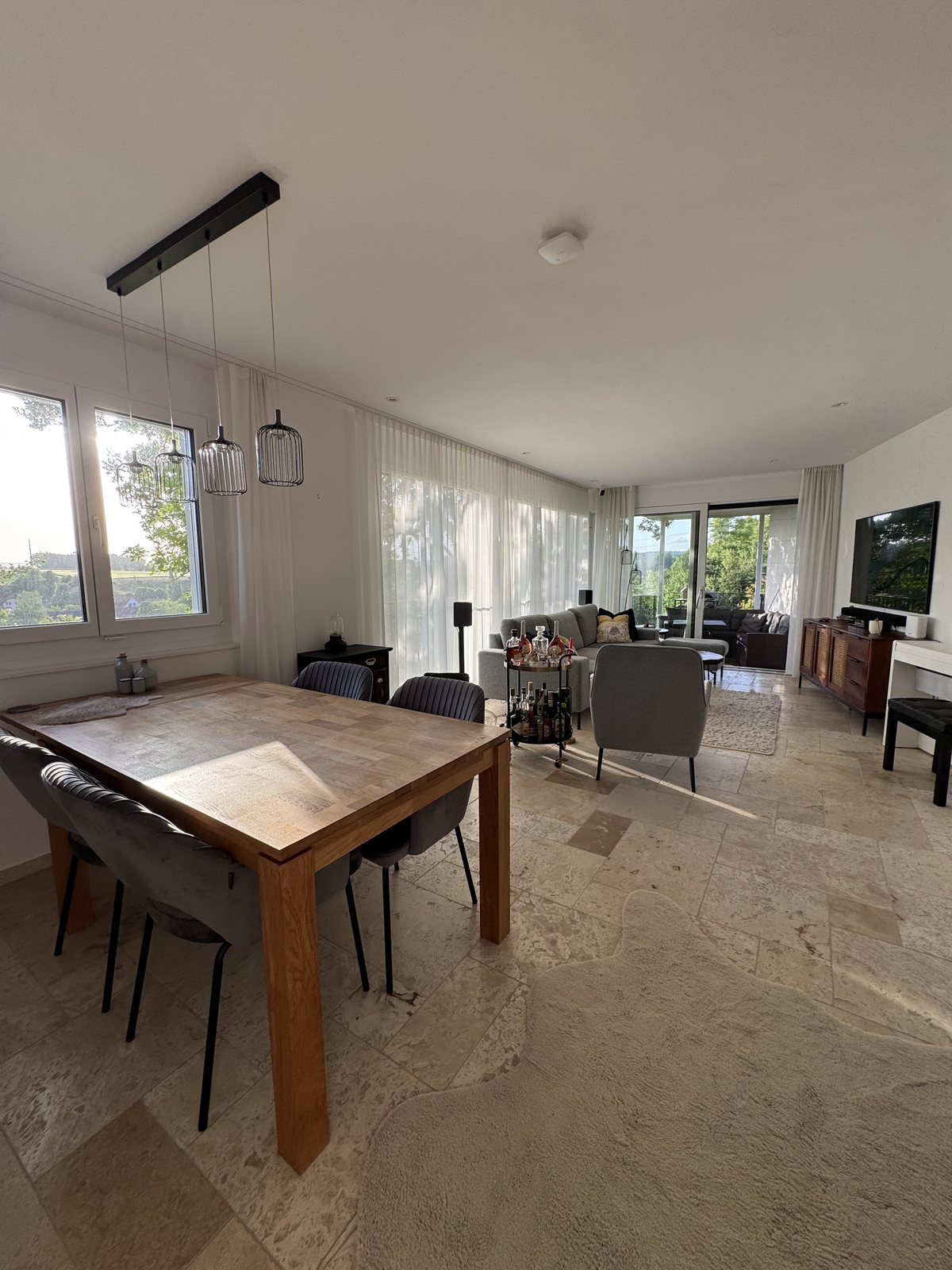 Open-plan living and dining space at Villa 77, furnished house near Baden, Aargau