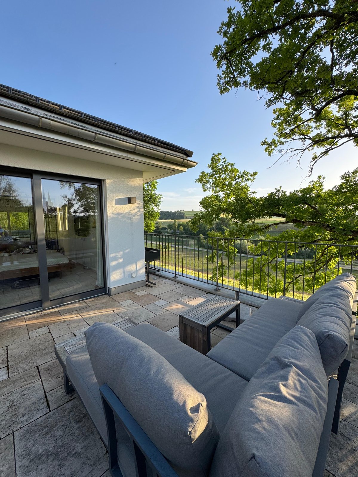 Terrace of Villa 77 with a wide, protected view — furnished private house near Baden, Aargau